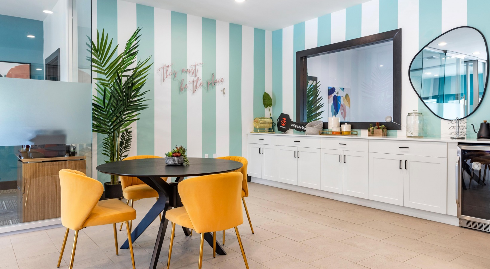 a kitchen with blue and white striped walls at The Marino