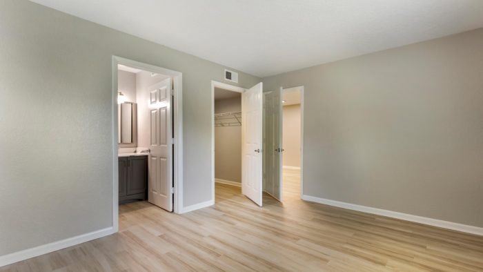 empty room with hardwood floors and a closet at The Marino
